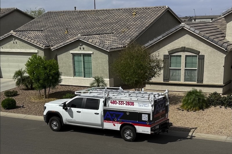 Fleet management for HVAC companies — HVAC service truck at a residential job site