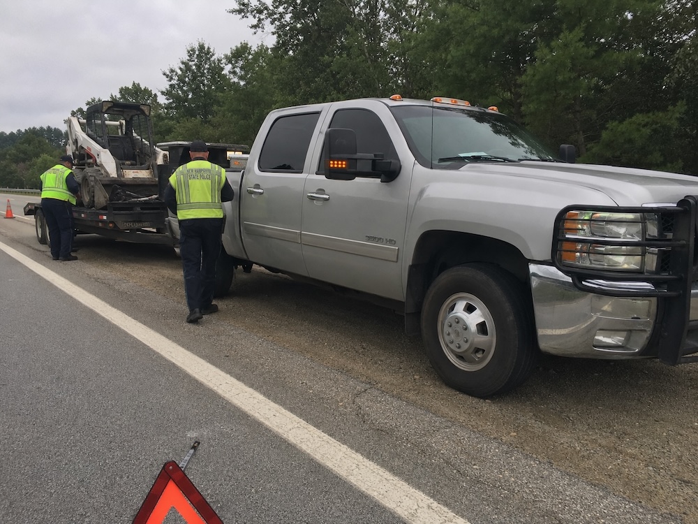 Construction vehicle stopped for a DOT roadside inspection — the kind of event that drives CSA scores